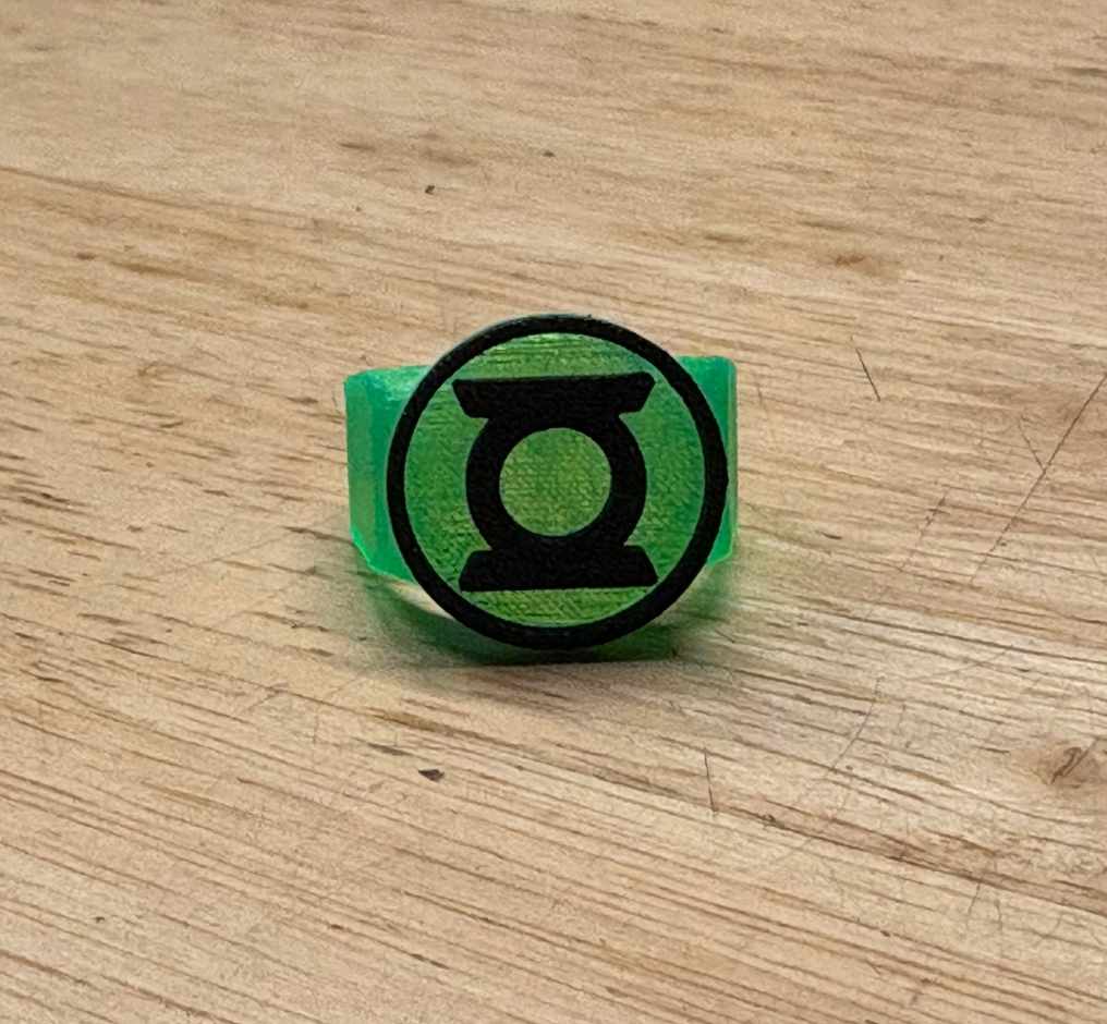 Original design — translucent green band and black emblem